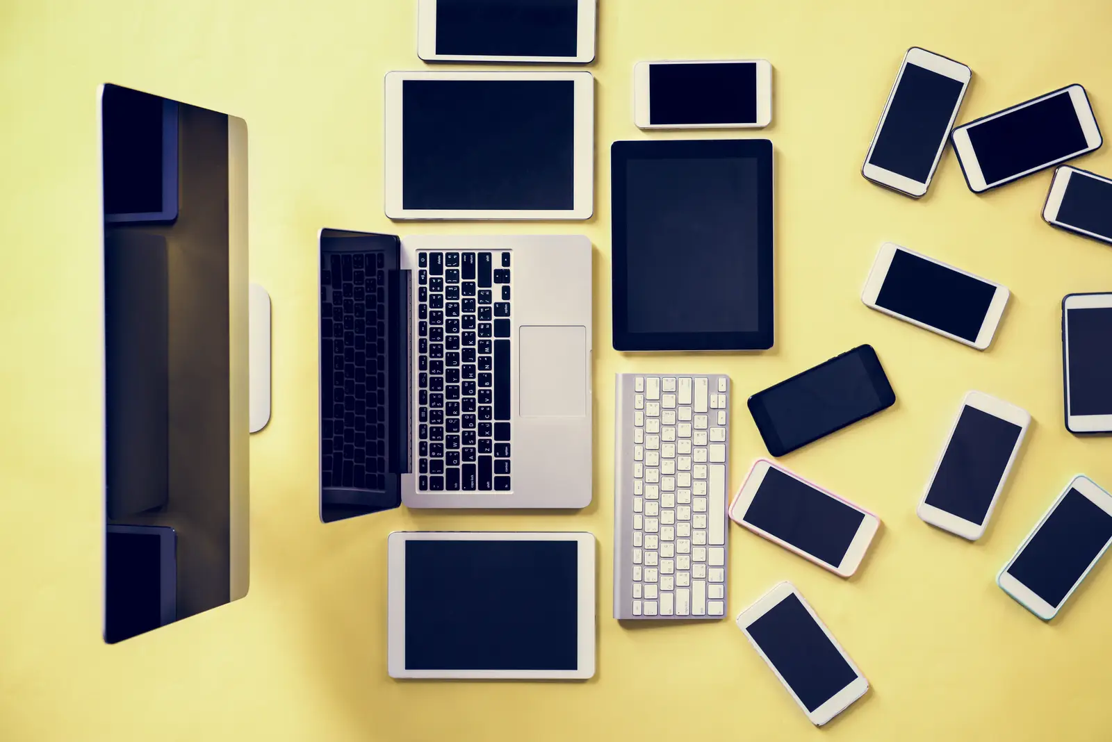 A collection of devices including laptops, tablets, and smartphones, illustrating responsive web design.