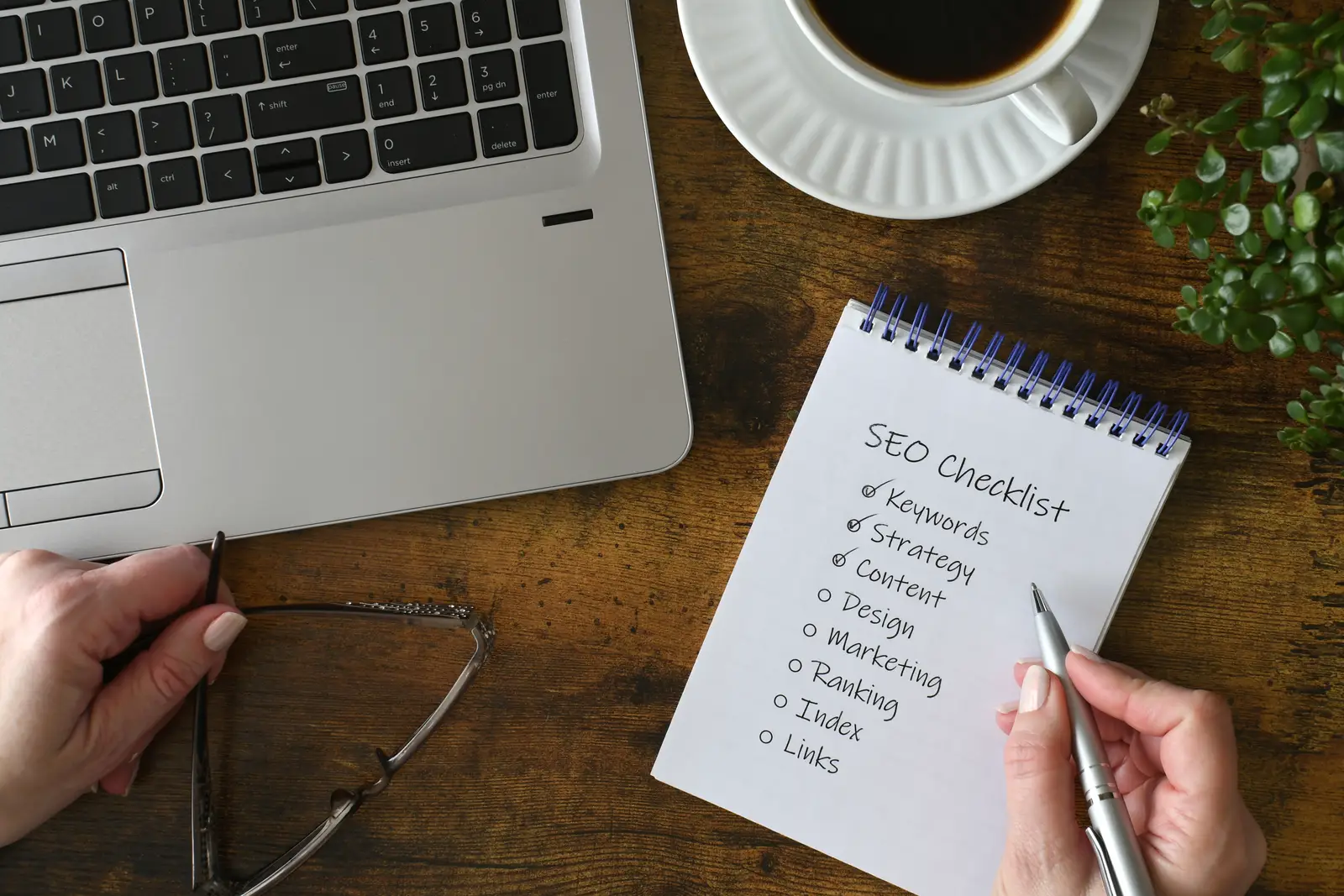 SEO checklist beside a laptop, focusing on SEO strategies for small businesses.